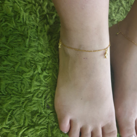Tobillera con 3 aleatorios  en Cruz Gold.